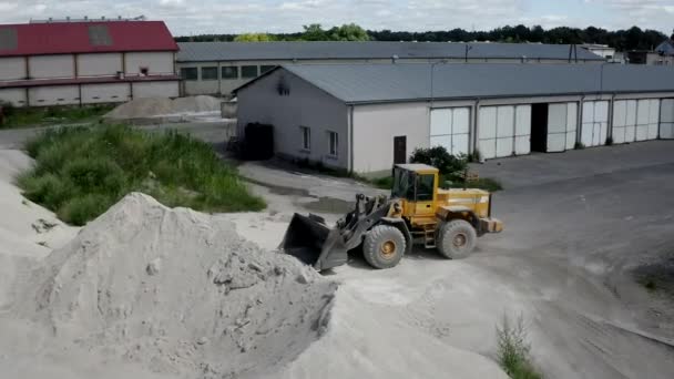 Wheel Loaders Loading A Scoop Of Gravel In A Tarmac Factory — Stock Video