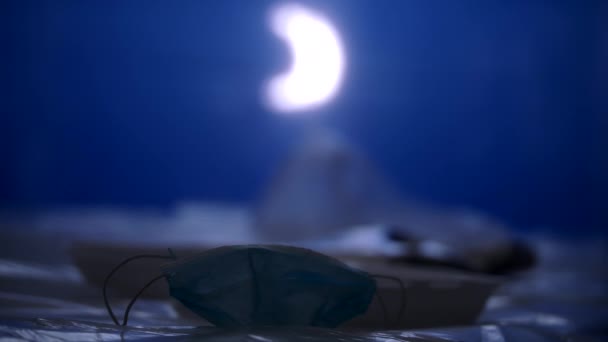 Slowmo: Surgical Mask And Trash Floating In A Sea Made Of Plastic At Night — Stock Video