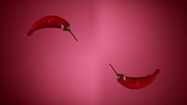 Fresh Spicy Chili Peppers Tossed Up Flying Hanging In The Air And Falling Down — Stock Video