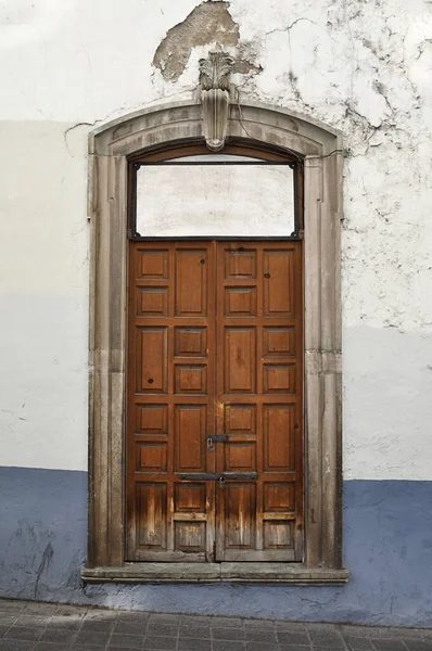 Colonial style Mexican old wooden door in Guanajuato Mexico