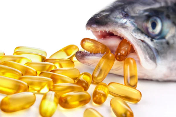 Omega-3 capsules with fish — Stock Photo, Image