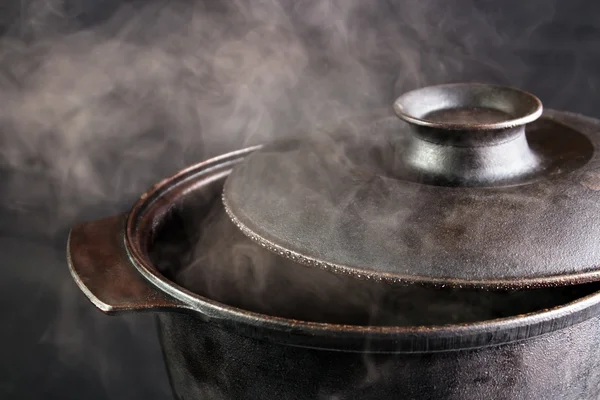 Steaming iron pot with opened cover — Stock Photo, Image