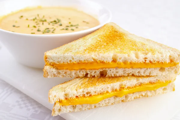 Cheese sandwiches with a bowl of soup — Stock Photo, Image