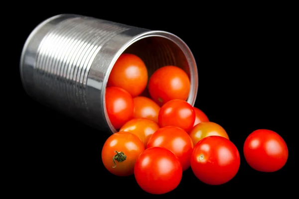 Cherry tomatoes and metal can — Stock Photo, Image