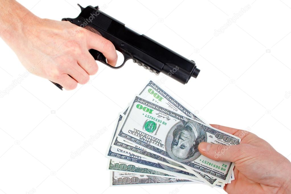 Hands with money and handgun