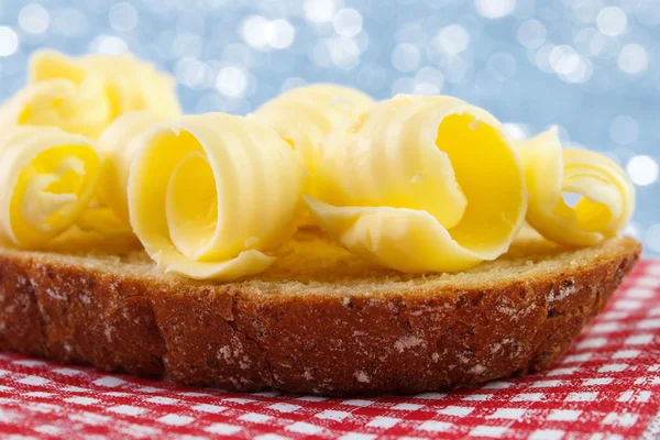 Bread with butter curls — Stock Photo, Image
