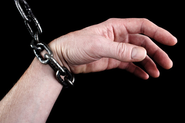 Hand in shackles