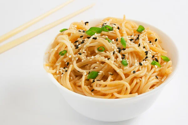 Sesame noodles on white background