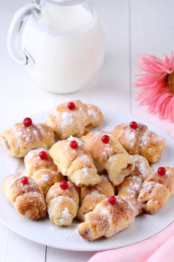 tasty cookies filled with fruit on the white table