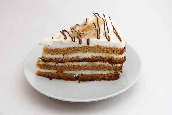 Un pedazo de pastel agrio en un plato de postre —  Fotos de Stock