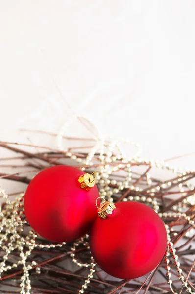 Red New Year's toys spheres on bright brilliant jewelry — Stock Photo, Image