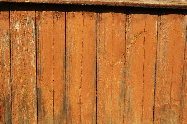 La pared de madera de color naranja pelada — Foto de Stock