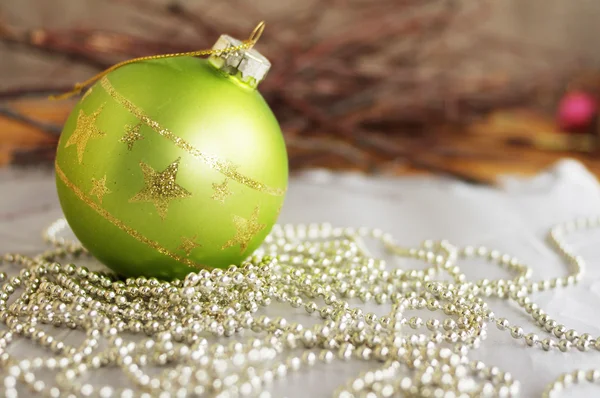 Christmas green glass sphere on a fir-tree — Stock Photo, Image