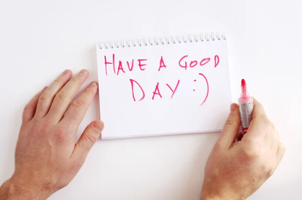 Have a good day-write male hands in a notebook