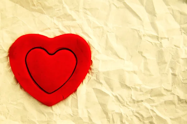 Red hearts on the white rumpled paper — Stock Photo, Image