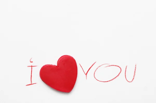 Red heart and the text "I love you", written by a red pencil on white paper. Romantic card St. Valentine's Day — Stock Photo, Image