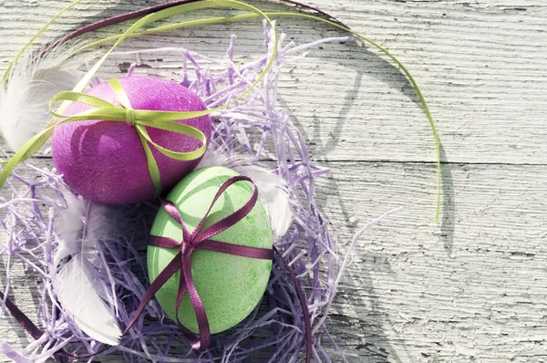 Easter eggs on old wooden background. — Stock Photo, Image