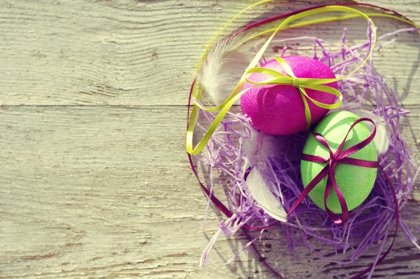 Easter eggs on old wooden background. — Stock Photo, Image