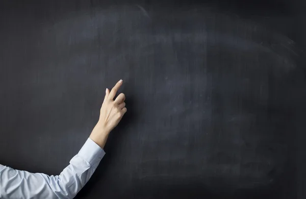 Blank blackboard with businesswoman hand pointing — Stock Photo, Image