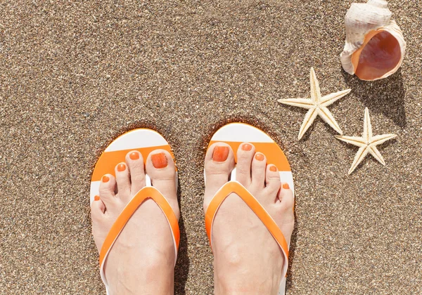 Female feet on sand — Stock Photo, Image