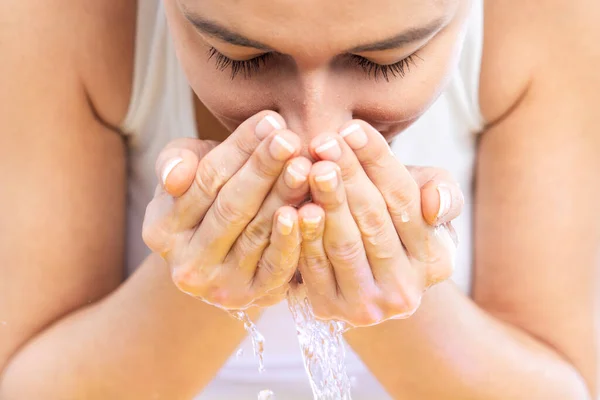 Beautiful Young Woman Washing Her Face Splashing Water Home Bathroom Royalty Free Stock Photos