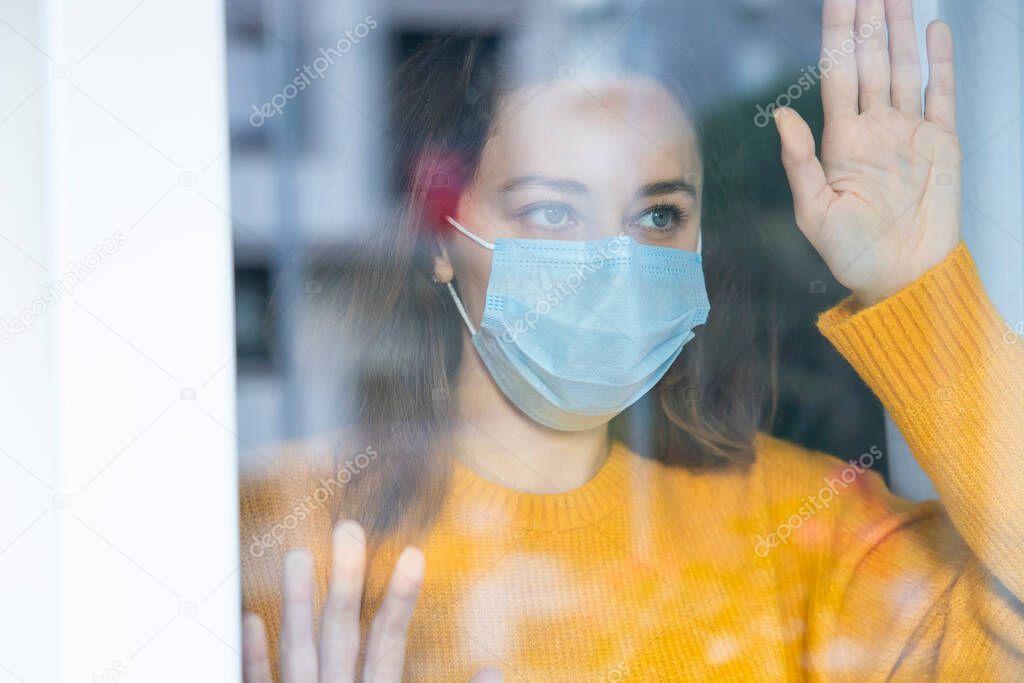 Young woman who cannot leave the house in quarantine due to an epidemic Covid-19