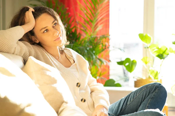 Attractive Young Woman Smiling While Sitting Sofa Hom — Foto de Stock