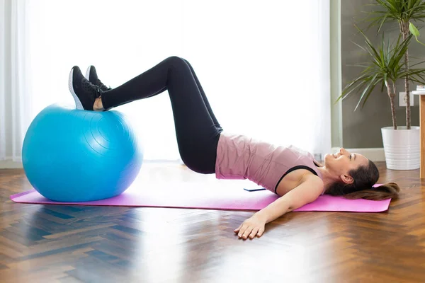 Young Woman Exercising Home Living Room She Exercising Fitness Bal — Stock Photo, Image