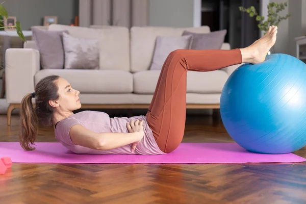 Young Woman Exercising Home Living Room She Exercising Fitness Bal — Stock Photo, Image