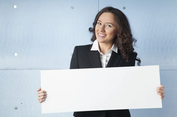 Business woman holding a banner — Stock Photo, Image