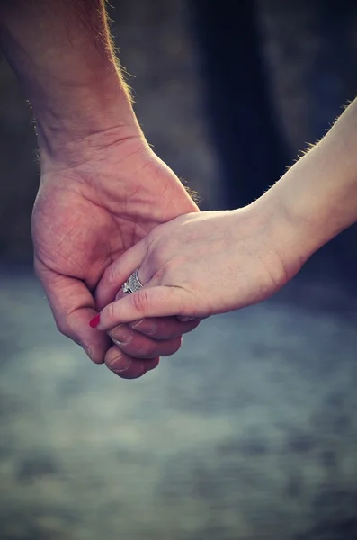 Happy couple holding hands — Stock Photo, Image