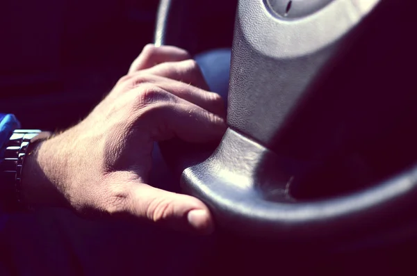 Driver hands holding steering wheel — Stock Photo, Image