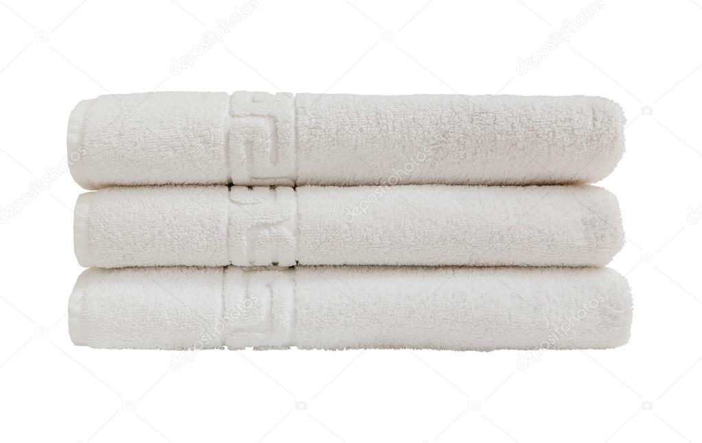 White bath towels in stack. Isolated