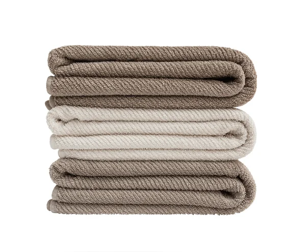 Três toalhas de banho em pilha isoladas sobre branco — Fotografia de Stock