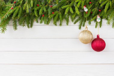 Christmas background. Christmas fir tree with decoration on white wooden board background, copy space.
