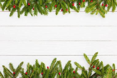 Christmas background. Christmas fir tree with decoration on white wooden board background, copy space