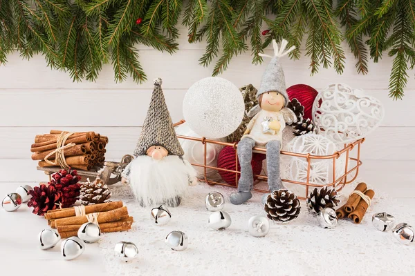 Christmas balls, gnome and angel, Christmas tree on white wooden background — Stock Photo, Image