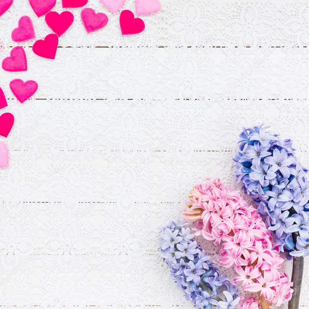 Valentines Day background with hearts and hyacinth flowers. Top view