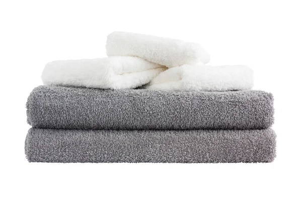Montón de toallas de baño grises y blancos. Aislado sobre blanco — Foto de Stock