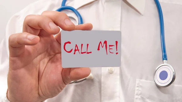 Call me. the doctor shows or holds a business card