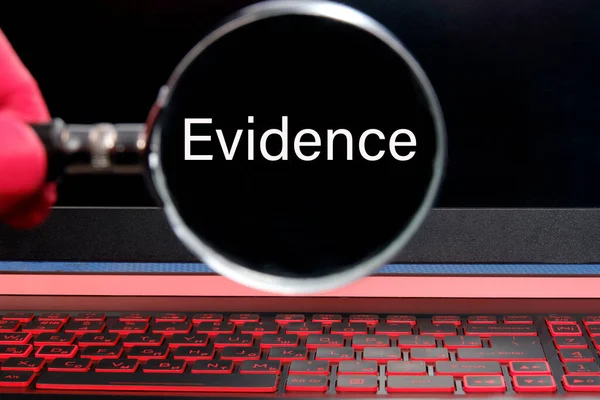 The magnifying glass focuses on the inscription evidence — Stock Photo, Image