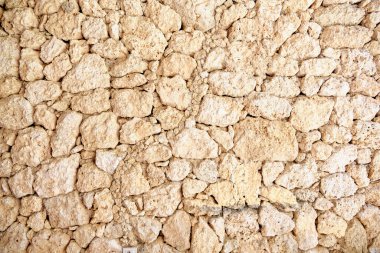 Arkaplan ya da doku olarak taş bir duvar.