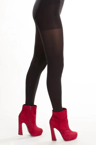 Black pantyhose and red footwear. — Stock Photo, Image