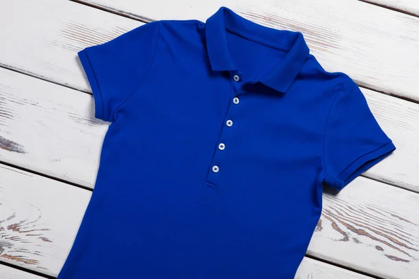 Casual blue polo t-shirt.