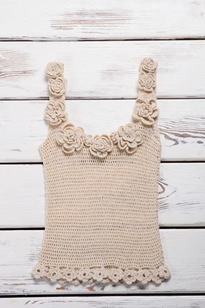 Beige knitted tank top.