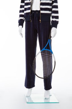 White mannequin with tennis racquet.