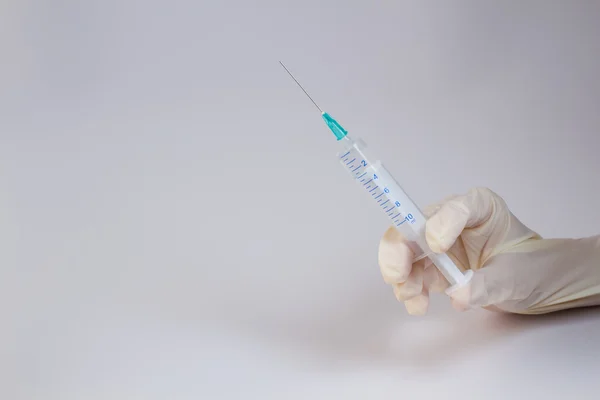 Syringe in the hand — Stock Photo, Image