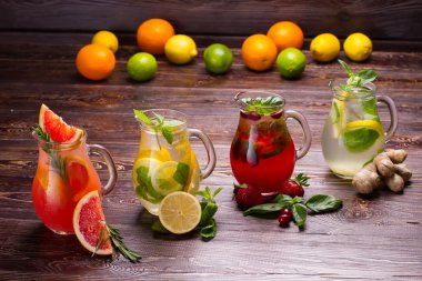 Summer drinks with ice,  berries and citrus fruits.