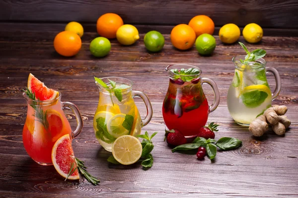 Summer drinks with ice,  berries and citrus fruits.