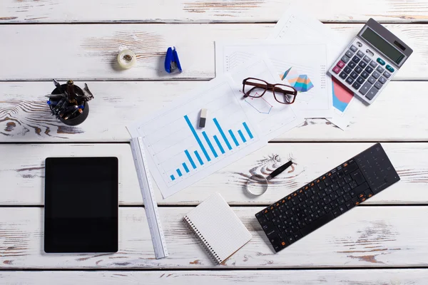 Stationery and gadgets on a wooden background. — Stock Photo, Image